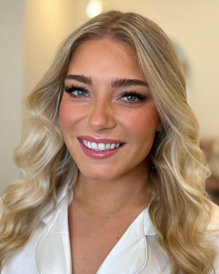 Alt text: Bride with clear lash gel on curled lashes, natural glossy lashes, minimal bridal makeup, soft wedding look