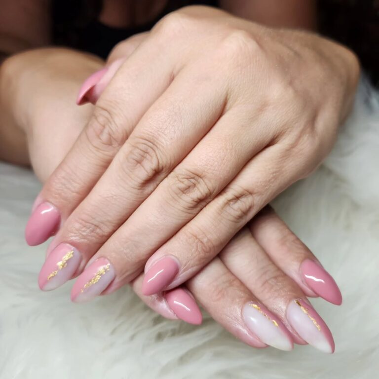 Dusty rose nails with thin hand-painted gold stripe detail, modern bridal nail art, close-up