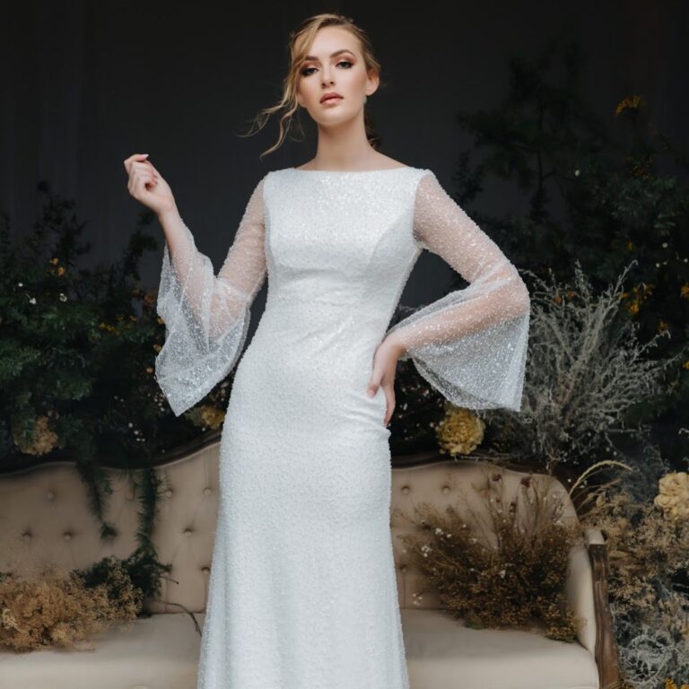 Alt text: Bride in a white high-neck sheath wedding dress, sleek and elegant courthouse bridal style