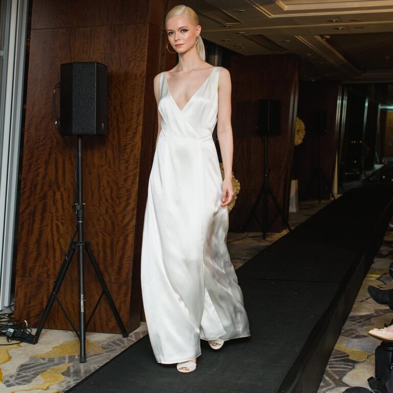 Alt text: Bride in a white wrap dress at courthouse wedding, flattering and elegant bridal style