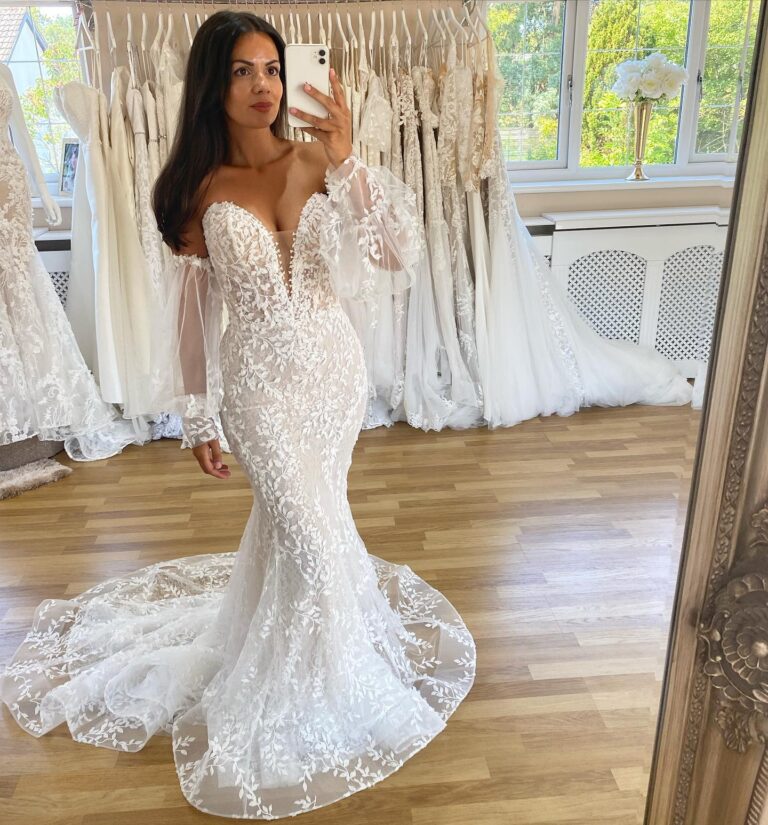 Alt text: Bride in a sheer overlay bridal dress at city hall, layered delicate fabric, civil ceremony wedding look