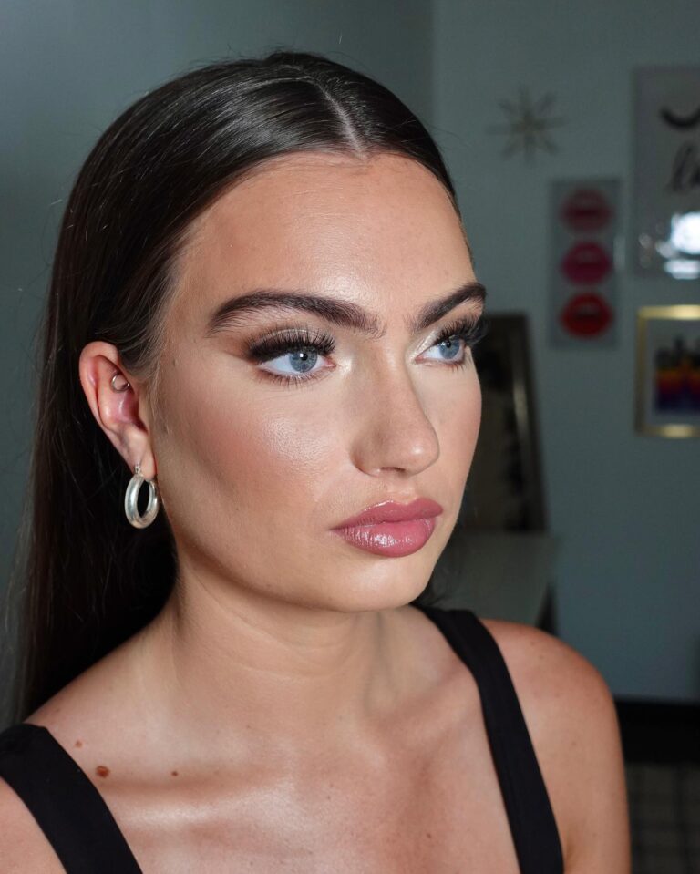 Bride with sheer bronze glow on face, warm sun-kissed bridal makeup, boho wedding look