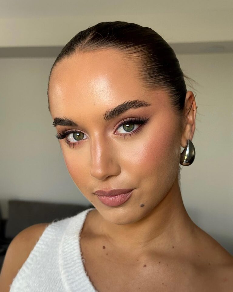 Bride with matching soft pink flushed cheeks and lips, cohesive monochromatic bridal makeup look