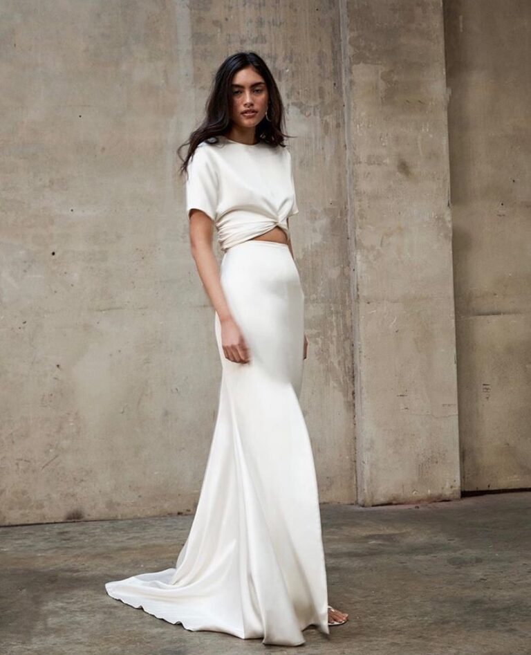 Bride in classic ivory A-line elopement dress, city ceremony, flattering simple silhouette