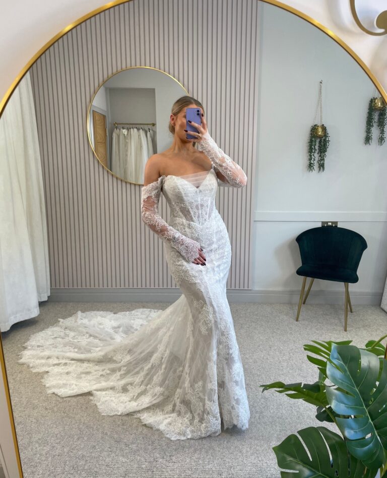 Bride in long-sleeve lace wedding dress, romantic autumn elopement, fitted bodice with lace arms
