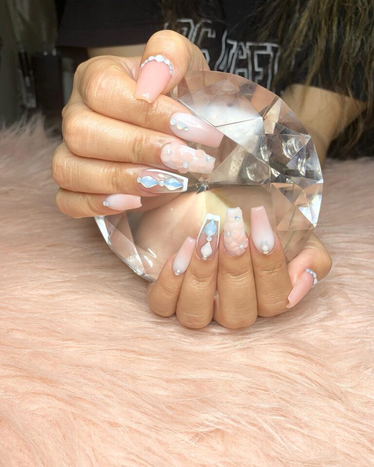 Dusty rose nails with tiny pearl nail embellishments on accent nail, romantic bridal manicure