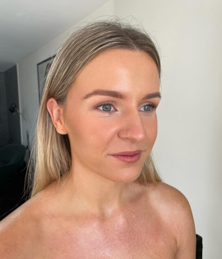 Alt text: Bride with completely bare eyelids, natural skin tone on lids, no eyeshadow minimal bridal look close-up
