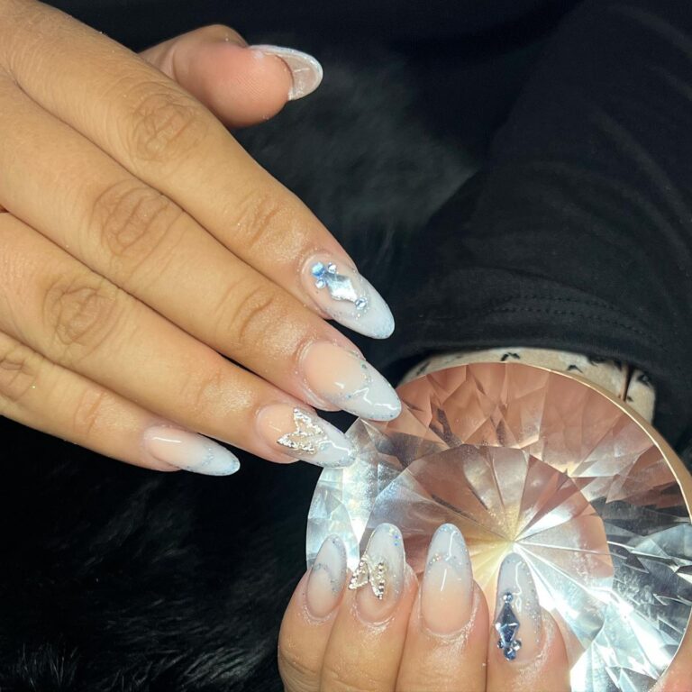 Alt text: Dusty blue ombre nails fading from sheer base to blue tips, soft gradient bridal manicure, wedding nails
